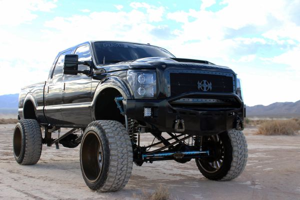 Black lifted truck with Royalty Core custom mesh grille installed